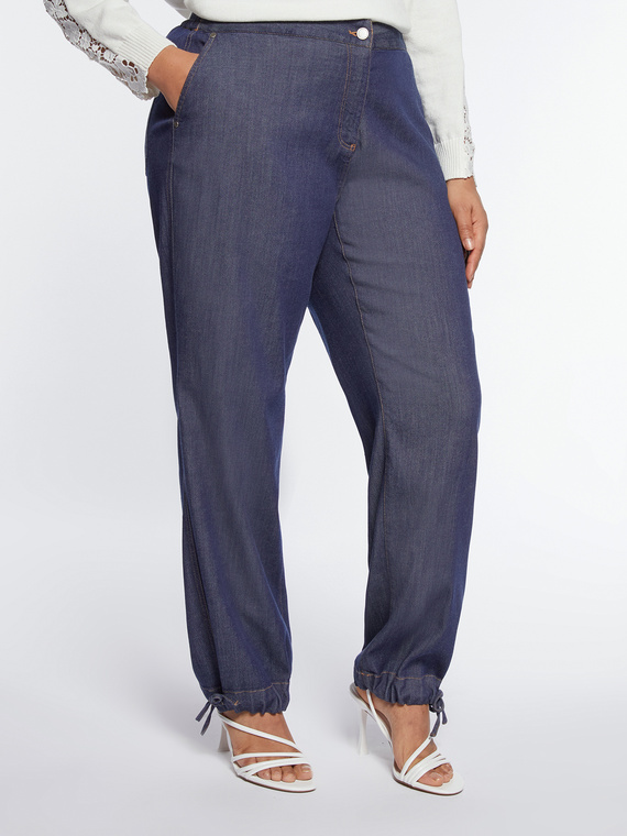 Wide flowing jeans with drawstring on the hem